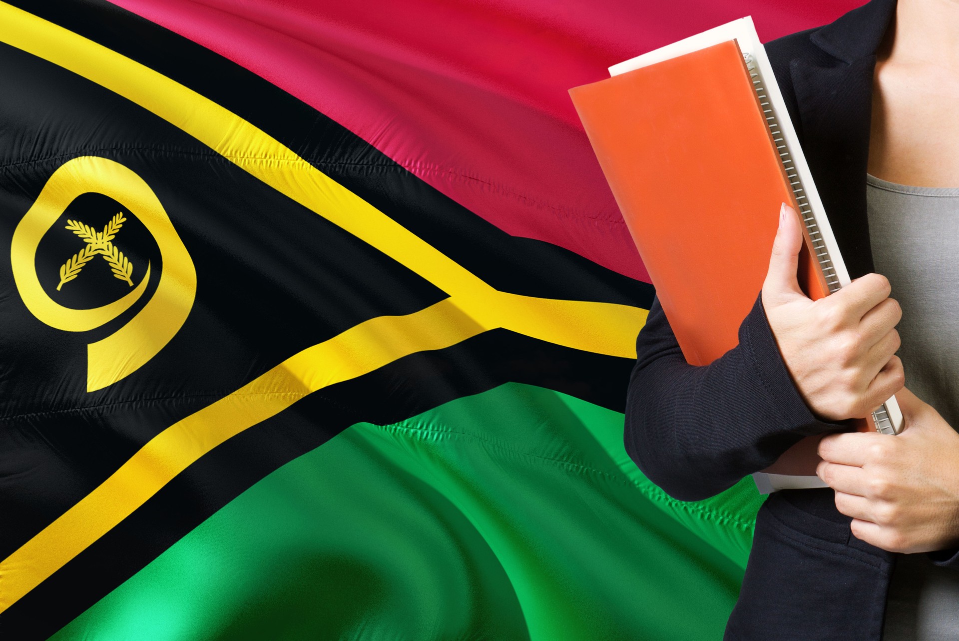 Learning language concept. Young woman standing with the Vanuatu flag in the background. Teacher holding books, orange blank book cover.